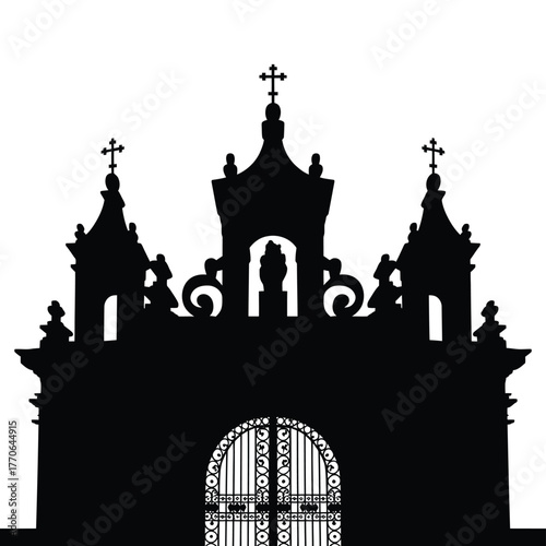 Ornate silhouette of a church facade with arched gate