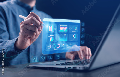 A data analyst using a stylus on a digital Big Data analytics dashboard showing charts, graphs, and SQL query results in real time. Perfect for business intelligence, data science, and IT technology.