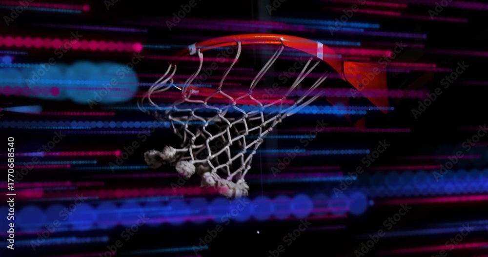 Naklejka premium Showing basketball hoop rim and frayed net glowing in dark gym, with red-blue light streaks