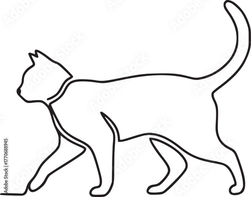 A playful cat walks across a clean white surface