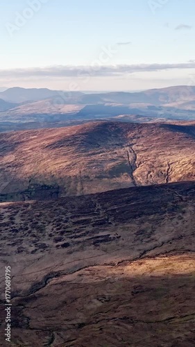 Serene landscape, sweeping views of Ireland's rugged mountains. Capture the beauty of nature with this stunning footage. Ideal for travel and nature documentaries.