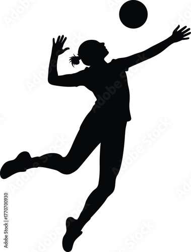 Silhouette of a female volleyball player jumping and spiking the ball during a game