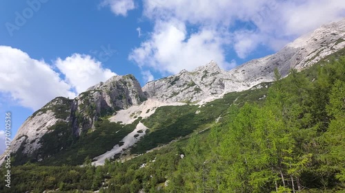 Great panoramic view of the Julian Alps with alpine landscape valleys and high rocky peaks, Slovenia.
