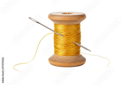 Golden thread wound on a wooden spool with a needle piercing through it isolated on transparent background