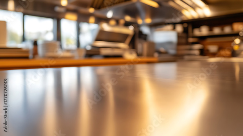 Wallpaper Mural Captured in a commercial kitchen, a gleaming metal surface reflects ambient light, suggesting cleanliness and efficiency. This blurred focus gives a sense of dynamic kitchen environment. Torontodigital.ca