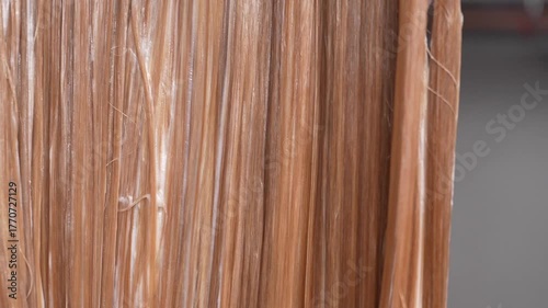 Close-up of blonde hair covered with nourishing mask, concept of deep treatment, hair repair, self care and wellness. Ideal for shampoo, conditioner, and cosmetic ads.
