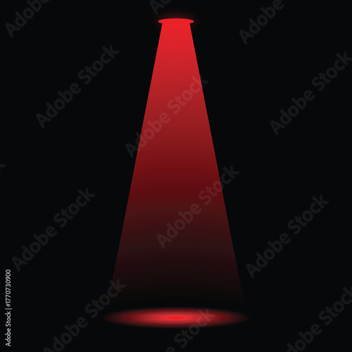 A single red spotlight beam illuminates a dark background dramatically