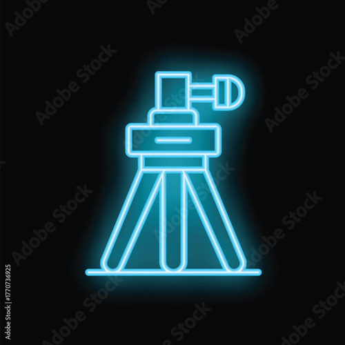 Neon blue perfume bottle standing on a tripod on a black background