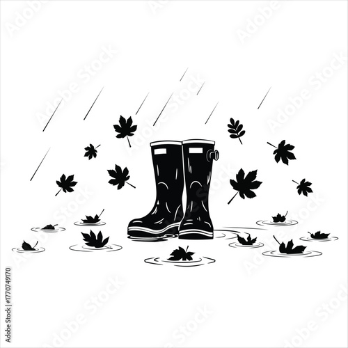 Pair of rubber rain boots standing in puddles with falling leaves and rain, a black and white autumn scene