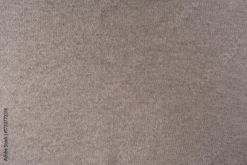 Soft grey merino wool sweater texture as a background.