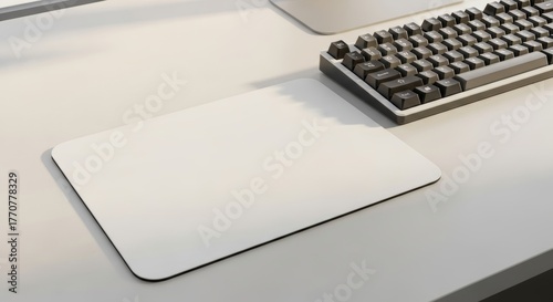 Minimalist workspace scene featuring a blank mousepad and keyboard elegance