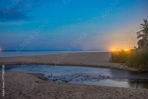 Fototapeta Naklejka Na Ścianę i Meble -  The river enters the Baltic Sea