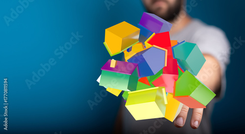 Fotografija A person is holding up a collection of colorful miniature houses