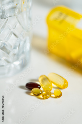 Different pills or vitamins near Weekly Pill Box, Daily Portable Travel Pill Box Organiser