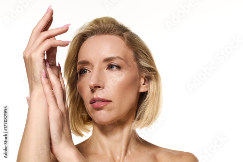 Wallpaper Mural Blonde beauty promoting skin care with a captivating expression and short hair Torontodigital.ca