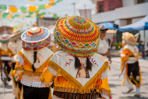 Sonajeros dancers wearing colorful traditional costumes, in the popular festival honoring Saint Joseph and the Holy Family in Zapotlan el grande, Ciudad Guzmán, Jalisco, Oct.2, 2025. Tuxpan