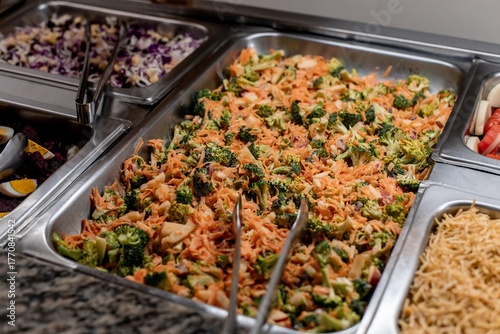 Carrot and broccoli salad on a buffet table