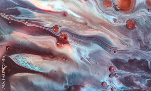 Macro photo of colorful liquid patterns with maroon, blue, and cream swirls. Abstract fluid texture resembling waves or marble with smooth flowing movement, abstract macro cool