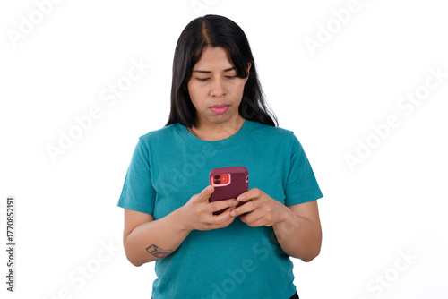 Woman in green T-shirt isolated on white background looking at her cell phone