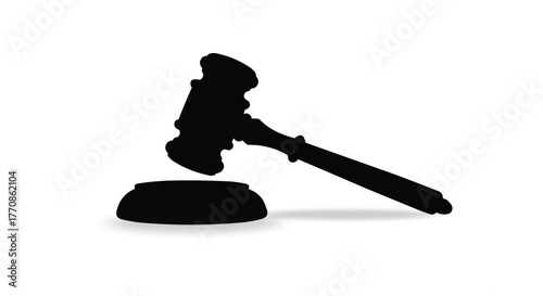 Black silhouette of a gavel and sounding block isolated on white background
