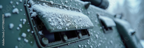 Close-up of icy armored vehicle hatch covered in frost and snowflakes on metal surface, cinematic lighting, military winter atmosphere, texture-rich composition