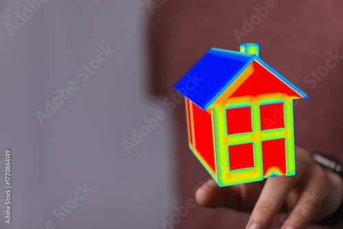 A hand holding a colorful h...