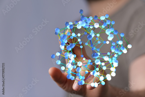 Hand holding a digital netw...
