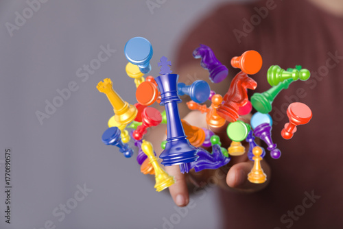 A person's hand holding col...