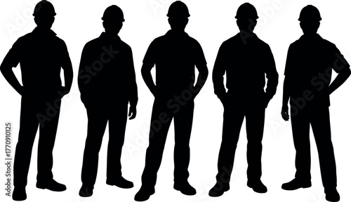 Silhouettes of five construction workers wearing hard hats standing proudly
