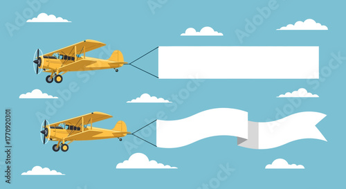Two yellow airplanes flying with blank banners for advertising messages.