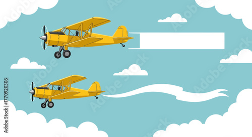 Two yellow biplanes flying in the sky with banners.