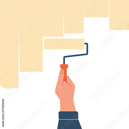 A hand holding a paint roller applies light yellow paint to a wall.