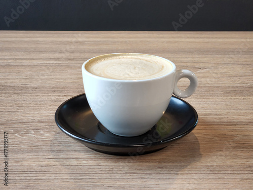 Brewed coffee in a porcelain cup. Hot coffee drink