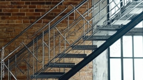 Industrial style metal staircase with elegant railings against a textured brick wall and bright