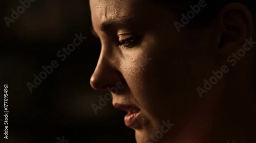 Cinematic Handheld Shot of Mother Breathing with Intense Moody Lighting
