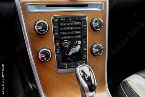 Εκτύπωση καμβά Modern car dashboard with elegant wood accent panel, multifunctional control sys