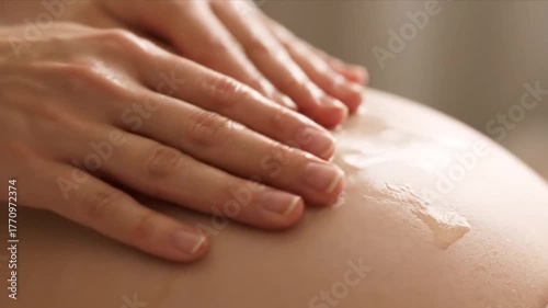 Midwife Performing Prenatal Massage with Tender Hands and Soft Lighting