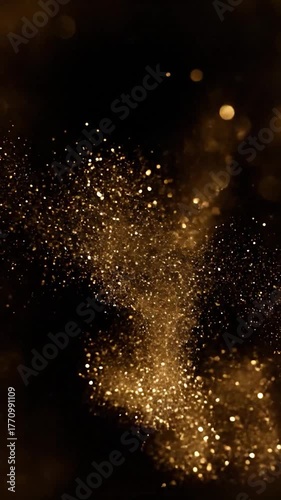 Golden glitter dust in dark space, ethereal light effect