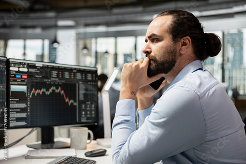 Papier peint Investment consultant frowning while looking at candlestick charts, bummed by poor portfolio performance
