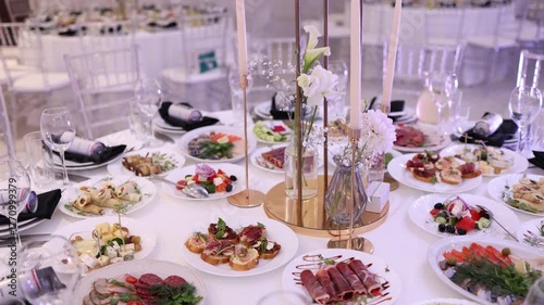 White wedding table with food and decorations