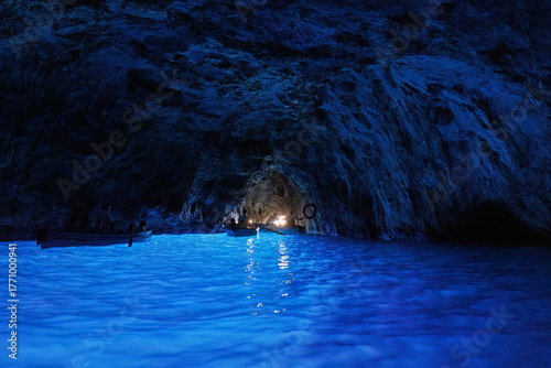 Scenic views of tourists on small boats inside the Blue Grotto on Capri Island, southern Italy