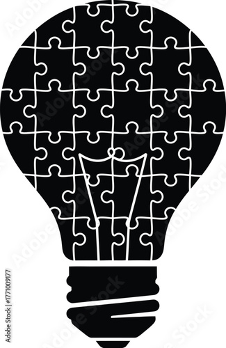 Black light bulb filled with puzzle pieces on a white background Keywords: light bulb, puzzle, jigsaw