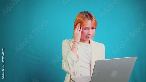 Stressed annoyed businesswoman working on laptop