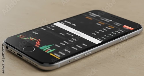 Smartphone displaying financial data and charts, illustrating trading and investment.