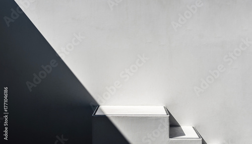 One sharp white concrete stair edge with a crisp cast shadow cutting diagonally from top-left; vast blank wall filling the frame, 70% negative space on the right. Hard noon light for graphic contrast,