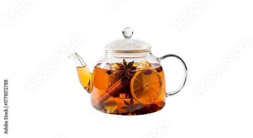 Glass teapot with hot fruit tea and spices on transparent background