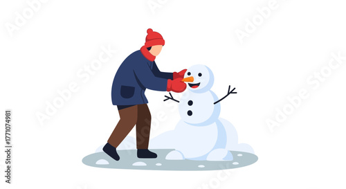 Person Building a Snowman in Winter