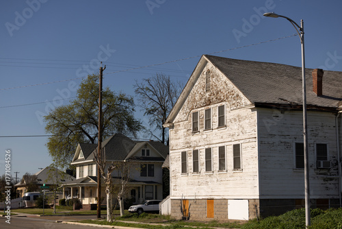 Afternoon view of historic homes in downtown Fowler, California, USA.