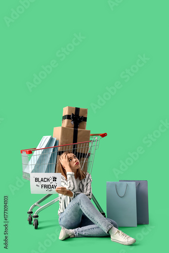 Tired young woman with shop...