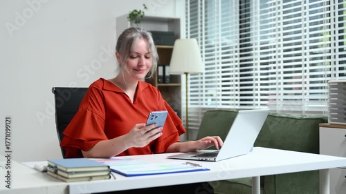 Successful businesswoman in modern office working on laptop.for doing math finance on an office desk, tax, report